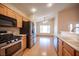 Kitchen features stainless steel appliances and opens to dining area with lots of light at 7500 Peaceful Brook St, Las Vegas, NV 89131