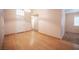 Open-concept living room boasting hardwood floors and neutral paint at 7500 Peaceful Brook St, Las Vegas, NV 89131