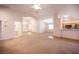Cozy living space showcasing plush carpeting, open layout, and natural light at 7500 Peaceful Brook St, Las Vegas, NV 89131
