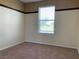 Empty bedroom with carpeted floor, neutral-colored walls and a window at 7788 Soda Canyon St, Las Vegas, NV 89139