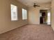 Living room with carpet flooring and lots of natural light from multiple windows at 7788 Soda Canyon St, Las Vegas, NV 89139