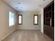 Living room with tile flooring, recessed lights, two windows, and a built in hutch at 7788 Soda Canyon St, Las Vegas, NV 89139