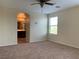 View of a main bedroom with arched entrance to ensuite bathroom at 7788 Soda Canyon St, Las Vegas, NV 89139