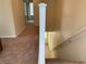 Hallway and staircase showcasing carpeted stairs and natural light at 7788 Soda Canyon St, Las Vegas, NV 89139