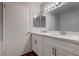 Bathroom with modern fixtures, double vanity, and white cabinets at 7905 Idledale Ct # 102, Las Vegas, NV 89145