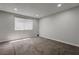 Bright bedroom featuring neutral color walls, carpet flooring, and a window providing natural light at 7905 Idledale Ct # 102, Las Vegas, NV 89145