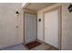 Cozy condo entrance with a welcome mat, security door and exterior light at 7905 Idledale Ct # 102, Las Vegas, NV 89145