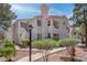 Beautiful condo with red tile roof, neutral stucco and mature landscaping at 7905 Idledale Ct # 102, Las Vegas, NV 89145