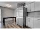 Modern kitchen features updated cabinets, stainless steel refrigerator and dining area at 7905 Idledale Ct # 102, Las Vegas, NV 89145