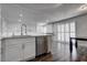 Bright kitchen with stainless steel dishwasher and views to the dining area at 7905 Idledale Ct # 102, Las Vegas, NV 89145