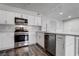 Modern kitchen featuring stainless steel appliances and white cabinetry at 7905 Idledale Ct # 102, Las Vegas, NV 89145