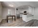 Dining room area and kitchen with stainless appliances and breakfast bar at 7905 Idledale Ct # 102, Las Vegas, NV 89145