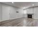 Bright living room with fireplace, wood floors and neutral paint at 7905 Idledale Ct # 102, Las Vegas, NV 89145