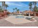 Resort-style pool area with spa, covered seating, palm trees, and lounge chairs at 7905 Idledale Ct # 102, Las Vegas, NV 89145