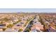 Community aerial view showing rooftops of homes in a planned community with city views at 8137 Cape Flattery Ave, Las Vegas, NV 89147