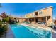 Beautiful backyard showcasing a pool, spa, lush greenery, and a covered outdoor living area at 8137 Cape Flattery Ave, Las Vegas, NV 89147
