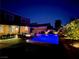 Well-lit backyard at night featuring a pool, patio, and outdoor living space, ideal for entertaining at 8137 Cape Flattery Ave, Las Vegas, NV 89147