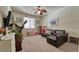 Carpeted bedroom with a ceiling fan, large window, and ample space at 8137 Cape Flattery Ave, Las Vegas, NV 89147