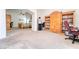 Spacious bedroom featuring a ceiling fan, carpet floors and large wooden cabinets at 8137 Cape Flattery Ave, Las Vegas, NV 89147