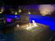 Cozy backyard fire pit area with comfortable seating, perfect for relaxing evenings by the pool at 8137 Cape Flattery Ave, Las Vegas, NV 89147