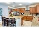 Modern kitchen featuring a large island with bar seating, stainless steel appliances, and sleek countertops at 8137 Cape Flattery Ave, Las Vegas, NV 89147