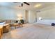 Spacious carpeted living room with ceiling fan and comfortable furnishings at 8137 Cape Flattery Ave, Las Vegas, NV 89147