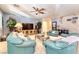 Inviting living room featuring comfortable sofas, a ceiling fan, and neutral décor at 8137 Cape Flattery Ave, Las Vegas, NV 89147