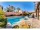 Beautiful backyard oasis with a refreshing pool, spa, and lush landscaping at 8137 Cape Flattery Ave, Las Vegas, NV 89147