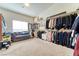 Massive walk-in closet with an abundance of storage space, shelving, and seating at 8137 Cape Flattery Ave, Las Vegas, NV 89147