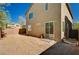Backyard featuring a sliding glass door and a block wall for privacy at 8164 Golden Cholla Ave, Las Vegas, NV 89179