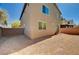 Backyard with a view of the house exterior and surrounding neighborhood at 8164 Golden Cholla Ave, Las Vegas, NV 89179
