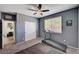 Comfortable bedroom featuring a ceiling fan, closet, and a treadmill workout area at 8164 Golden Cholla Ave, Las Vegas, NV 89179