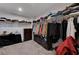 Spacious walk-in closet with built-in shelving and ample storage for clothes and accessories at 8164 Golden Cholla Ave, Las Vegas, NV 89179