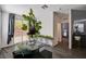 Cozy dining area with a table, stools, and sliding glass doors to the backyard at 8164 Golden Cholla Ave, Las Vegas, NV 89179