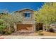 Charming two-story home featuring a well-maintained front yard and a two-car garage at 8164 Golden Cholla Ave, Las Vegas, NV 89179