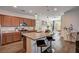 Modern kitchen features a granite island, stainless steel appliances, and stylish pendant lighting at 8164 Golden Cholla Ave, Las Vegas, NV 89179