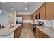 Modern kitchen featuring stainless steel appliances, granite countertops, and custom cabinets at 8164 Golden Cholla Ave, Las Vegas, NV 89179
