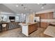 Open-concept kitchen with granite countertops, stainless steel appliances, and a view into the living area at 8164 Golden Cholla Ave, Las Vegas, NV 89179