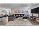 Spacious living room with a comfortable sectional sofa and stylish decor at 8164 Golden Cholla Ave, Las Vegas, NV 89179