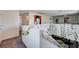 A spacious loft area with vibrant wall art and an open view of the lower level, perfect for relaxing at 8164 Golden Cholla Ave, Las Vegas, NV 89179