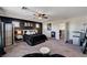 Spacious main bedroom with dark accent wall, ambient lighting, and cozy furnishings for a peaceful retreat at 8164 Golden Cholla Ave, Las Vegas, NV 89179