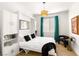 Murphy bed in bedroom with desk and shelving for a work from home space at 8317 Fritzen Ave, Las Vegas, NV 89131