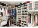 Organized walk-in closet with shelving, hanging racks, and ample storage space at 8317 Fritzen Ave, Las Vegas, NV 89131