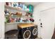 Functional laundry room with shelving, washing machine and dryer at 8317 Fritzen Ave, Las Vegas, NV 89131