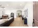 Bright and airy living room with wood floors, piano, and stylish décor at 8317 Fritzen Ave, Las Vegas, NV 89131