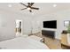 Spacious main bedroom includes ceiling fan, television, and ensuite bathroom at 8317 Fritzen Ave, Las Vegas, NV 89131
