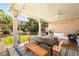 Inviting covered patio with dining area and comfortable seating, perfect for outdoor relaxation and entertaining at 8317 Fritzen Ave, Las Vegas, NV 89131