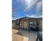 Cozy single-story home featuring a covered front porch and well-lit windows at 851 W Carey Ave, North Las Vegas, NV 89030