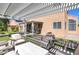 Lovely backyard with a covered patio, seating area, and attractive landscaping at 9469 Coral Shine Ct, Las Vegas, NV 89123