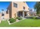 Beautiful backyard featuring an outdoor covered patio, lush landscaping, and plenty of space to relax at 9469 Coral Shine Ct, Las Vegas, NV 89123